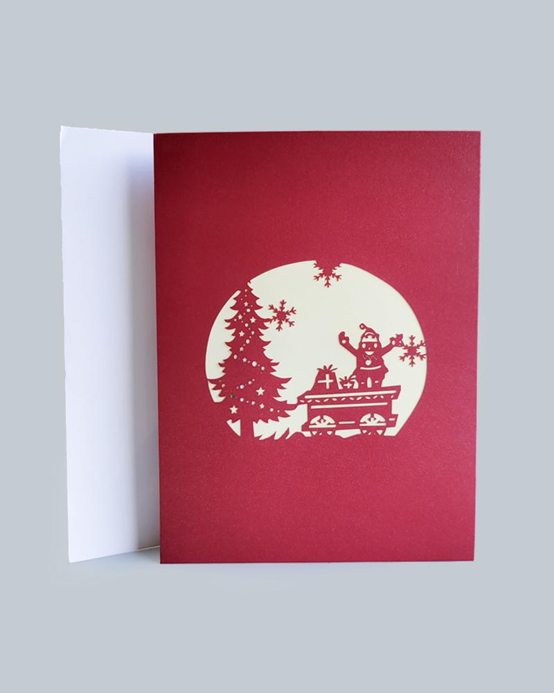 Santa's Wonderland 3D Pop-Up Card against white envelope
